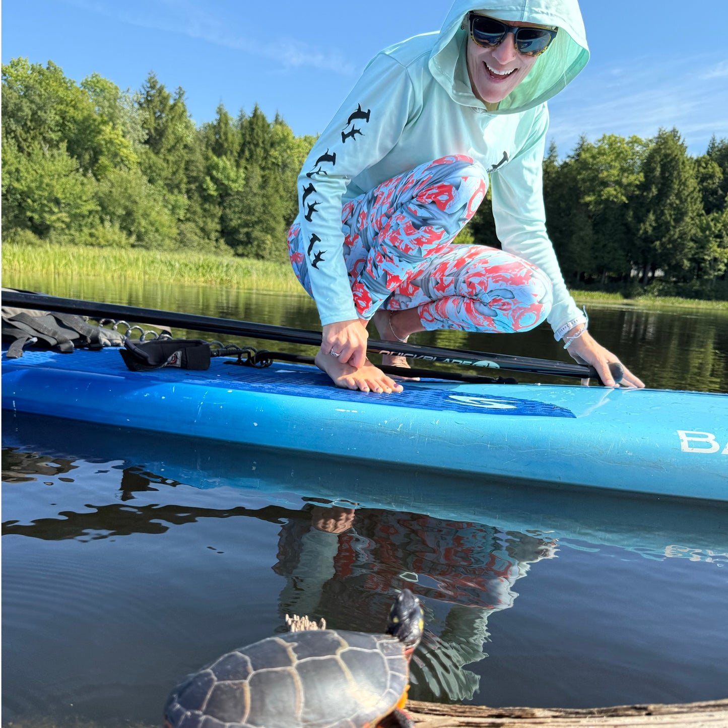 Fin & Fierce Hammerhead sustainable swim leggings blue and red background