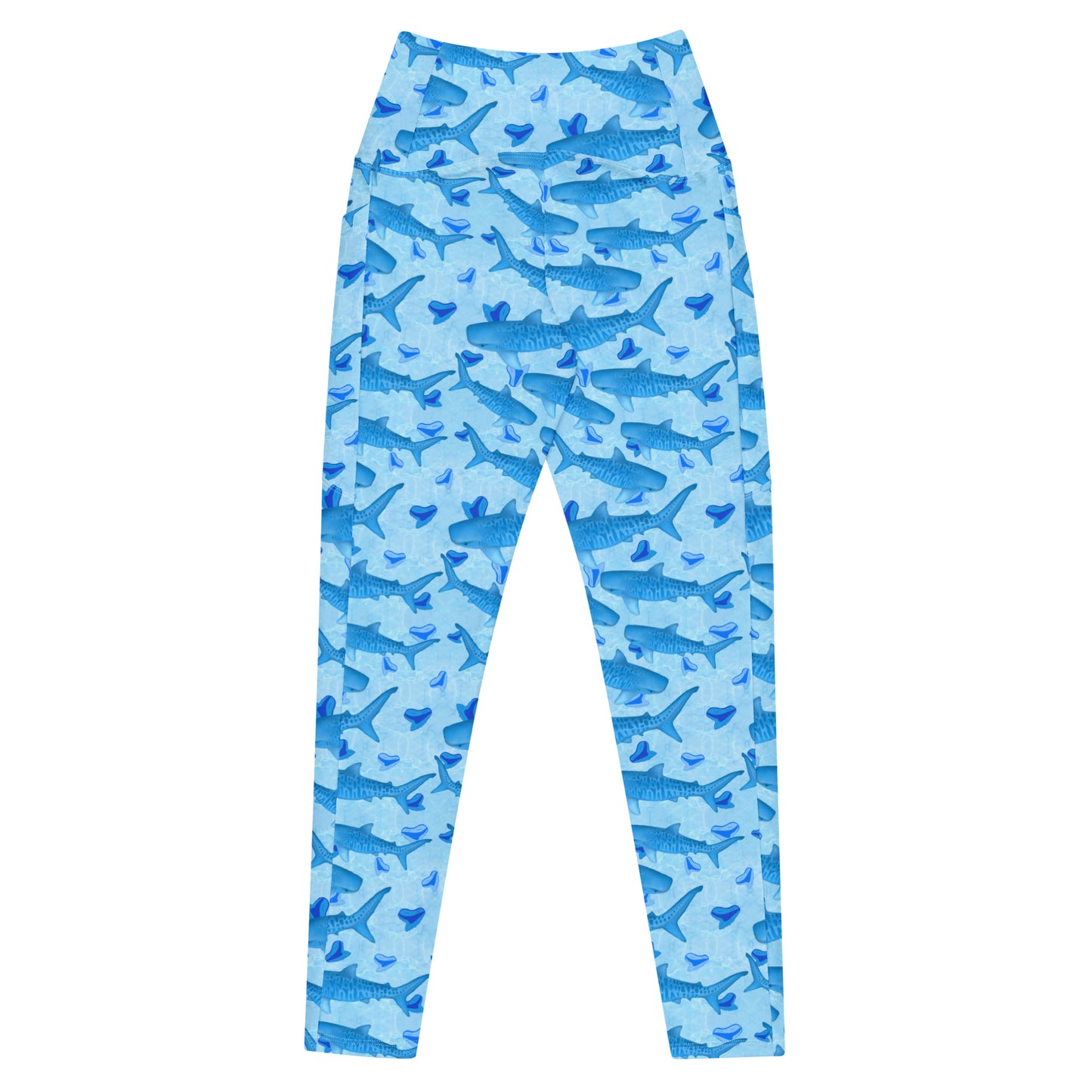 Baby blue waves and Sky Blue Tiger sharks swim around royal blue tiger shark teeth on our Tiger Beach Blues Recycled dive leggings with pockets