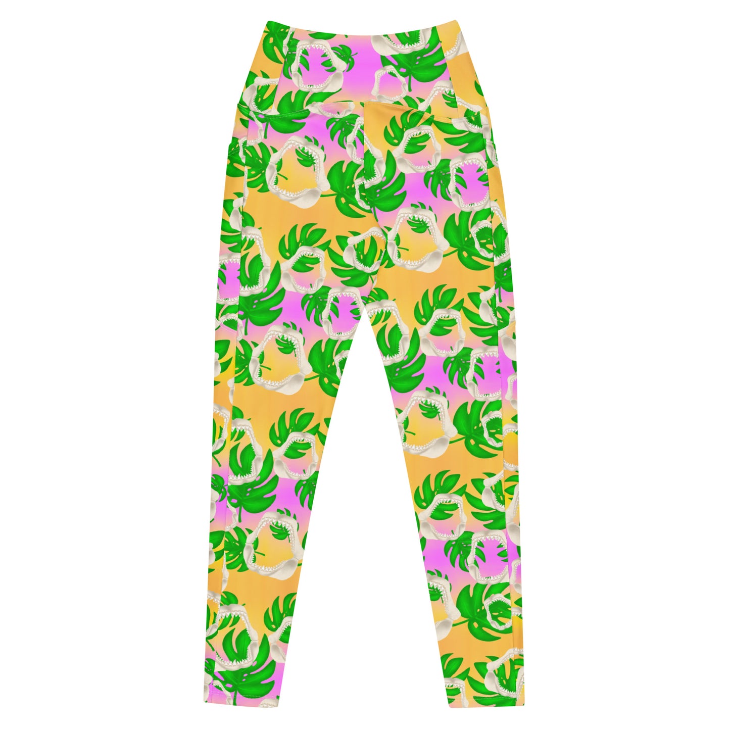 A warm golden yellow and pinky lilac sunset ombré background with megalodon jaws and monstera leaves on our Meg Monstera Recycled dive leggings with pockets