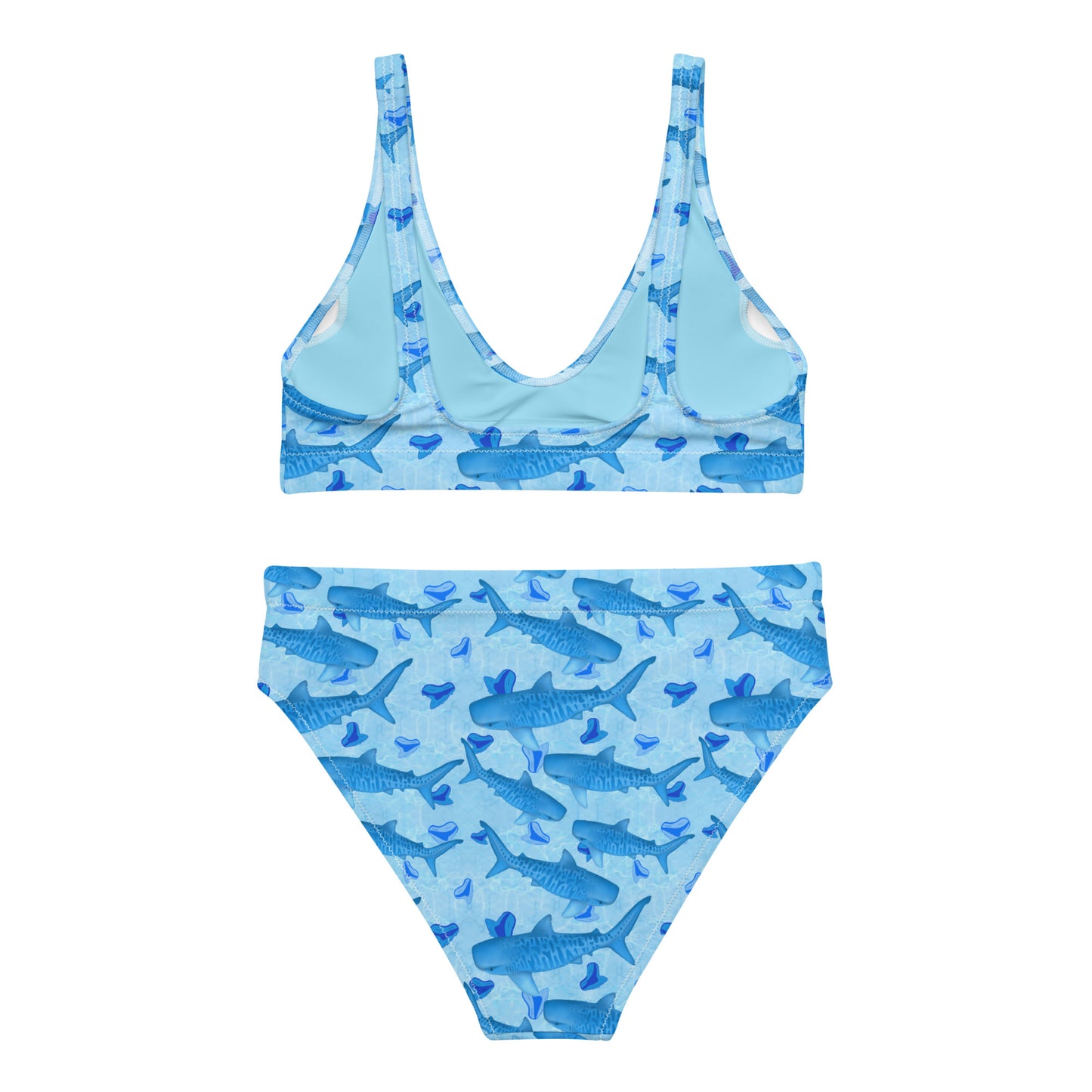 Baby blue waves and Sky Blue Tiger sharks swim around royal blue tiger shark teeth on our Tiger Beach Blues Recycled high waisted bikini