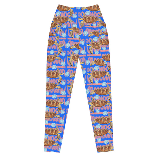 Royal blue and peachy background with sea turtles and moon jellyfish. Eco dive leggings