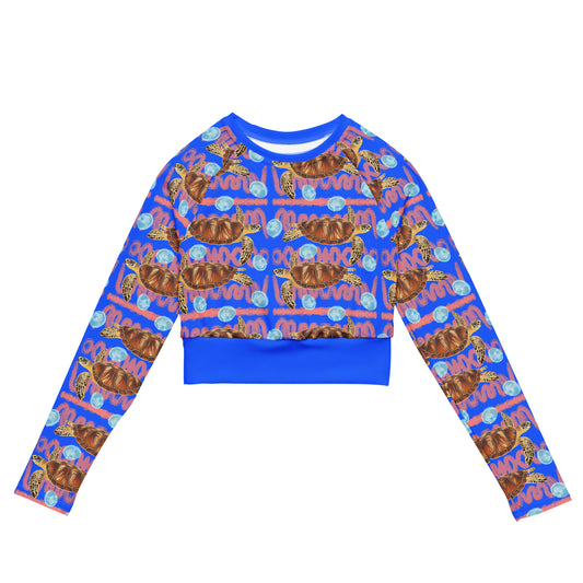 Royal blue and peachy background with sea turtles and moon jellyfish. Cropped eco rashguard 
