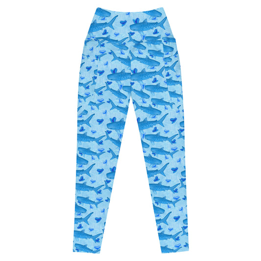Baby blue waves and Sky Blue Tiger sharks swim around royal blue tiger shark teeth on our Tiger Beach Blues Recycled dive leggings with pockets 