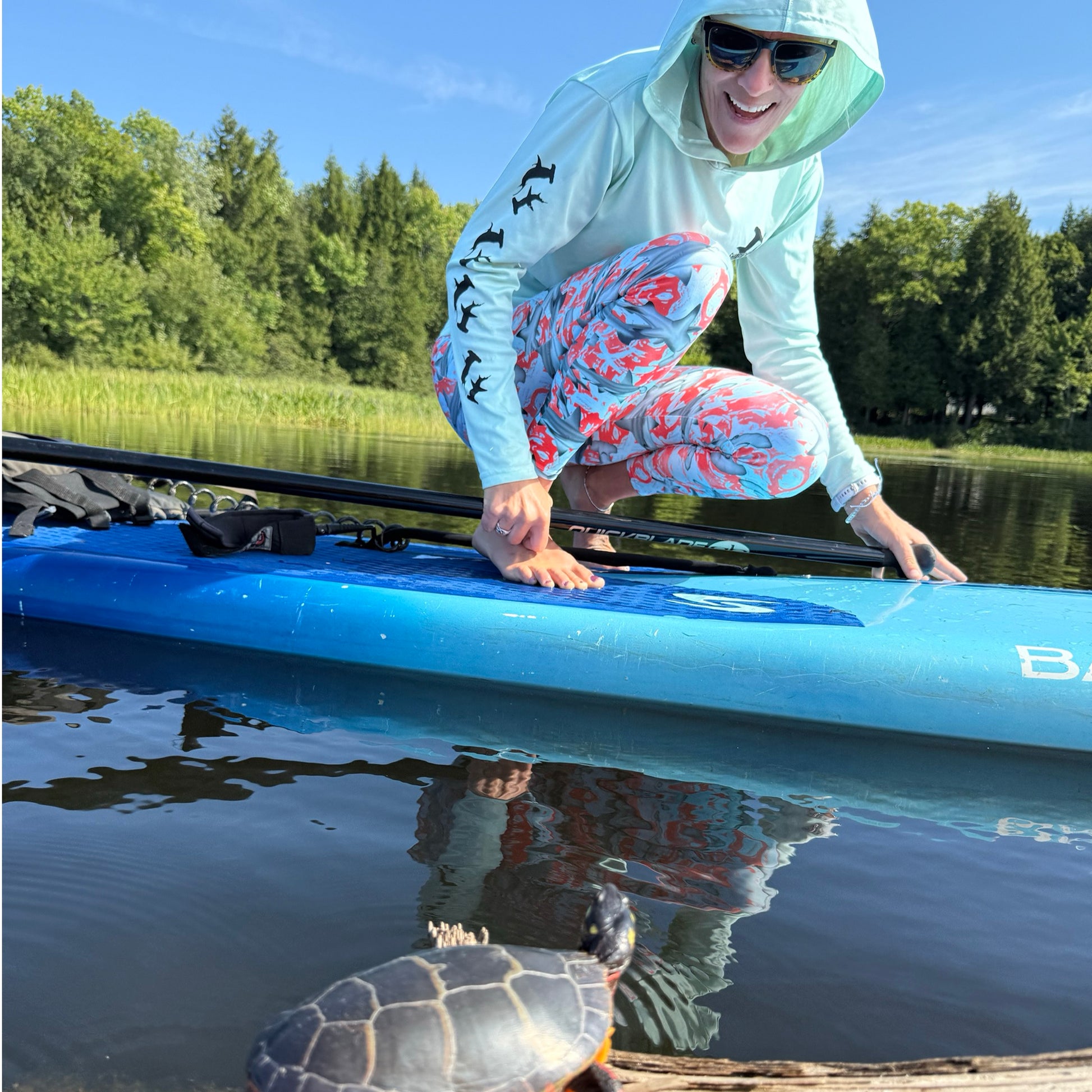 Fin & Fierce Hammerhead sustainable swim leggings blue and red background