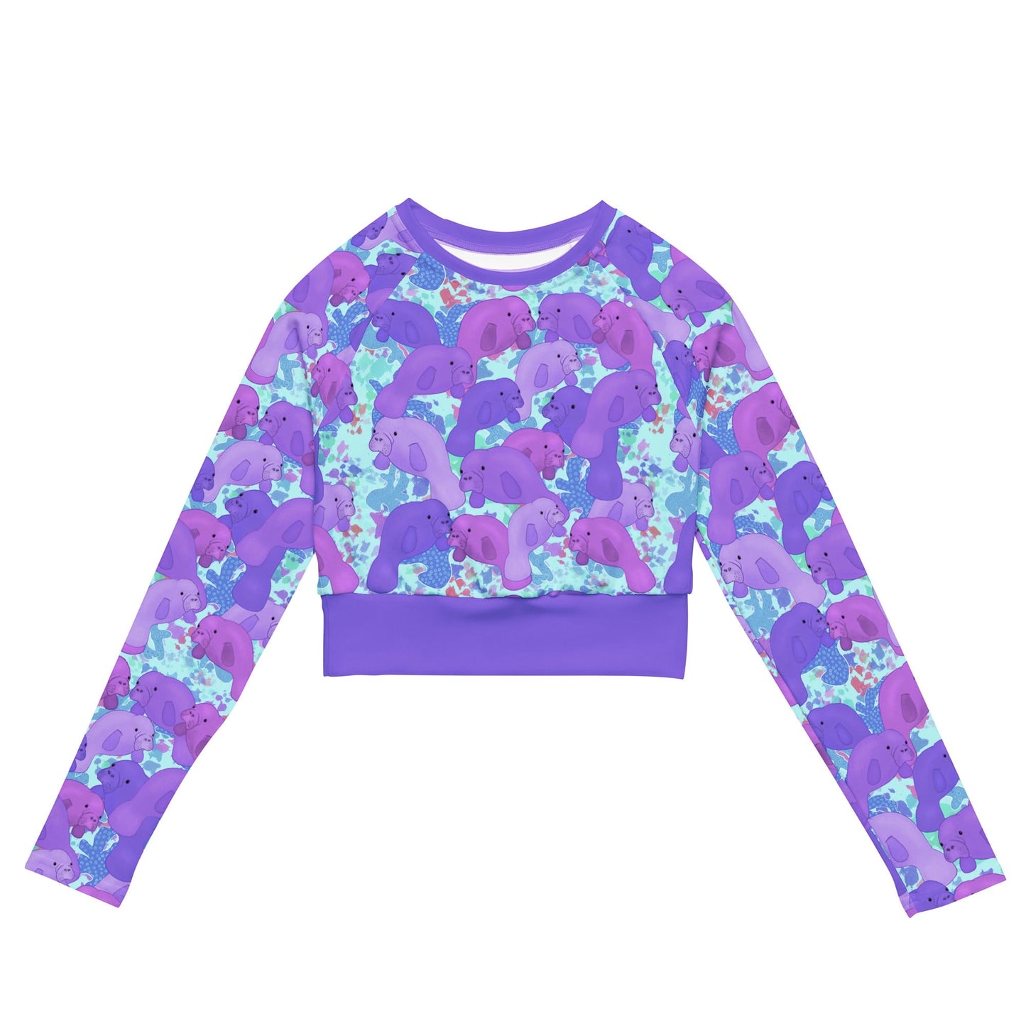 Purple manatees on a blue background of a cropped sustainable rashguard 