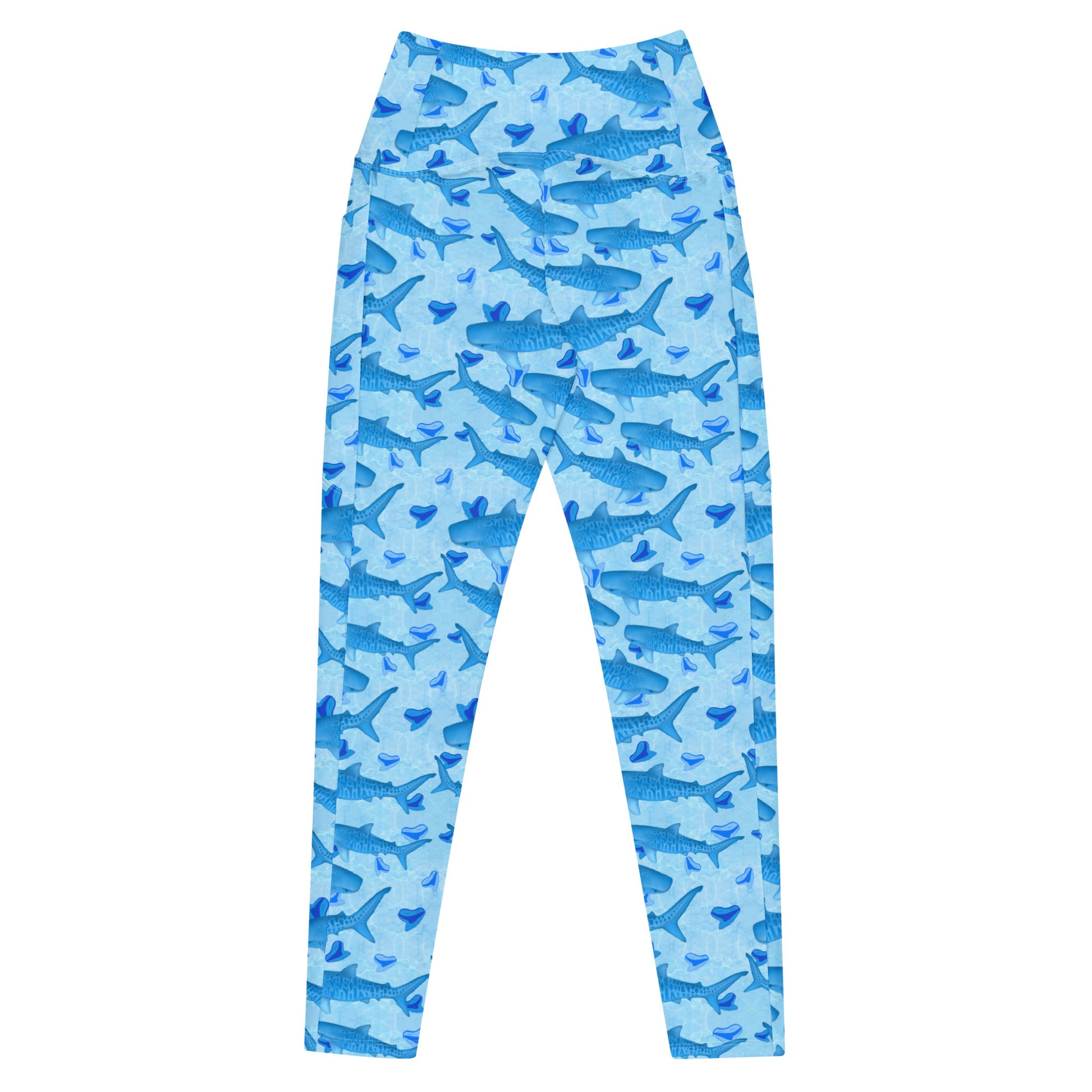 Baby blue waves and Sky Blue Tiger sharks swim around royal blue tiger shark teeth on our Tiger Beach Blues Recycled dive leggings with pockets 