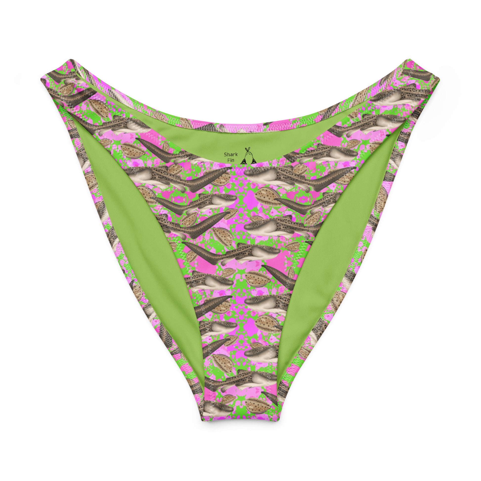 Green and pink patterned bikini bottom with zebra sharks and cowrie shells on a white background