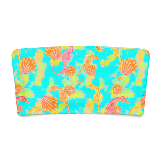 Pink and orange seahorses with sunrise seashells. Light aqua blue and yellow background with a neon yellow band. Eco bandeau bikini top