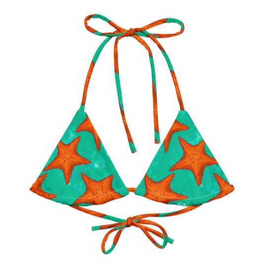 Triangular bikini top with starfish pattern in orange and green on a white background
