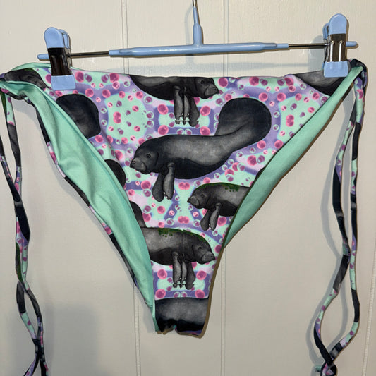 Manatees with purple, mint and pink background string bikini bottoms 