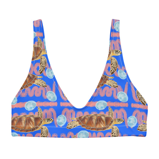Royal blue and peachy background with sea turtles and moon jellyfish. Eco sporty bikini top 