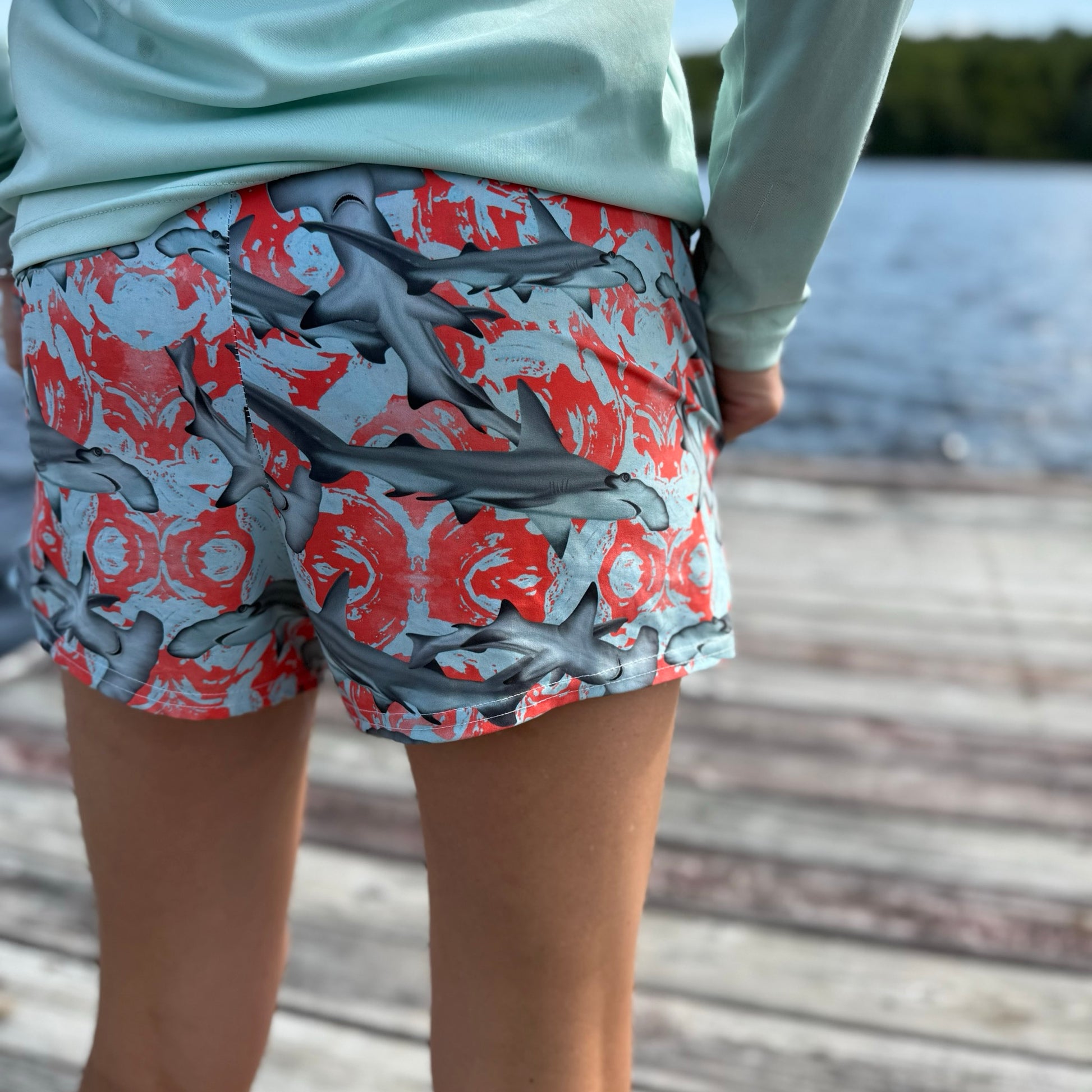 Fin & Fierce Hammerhead sustainable athletic short blue and red background