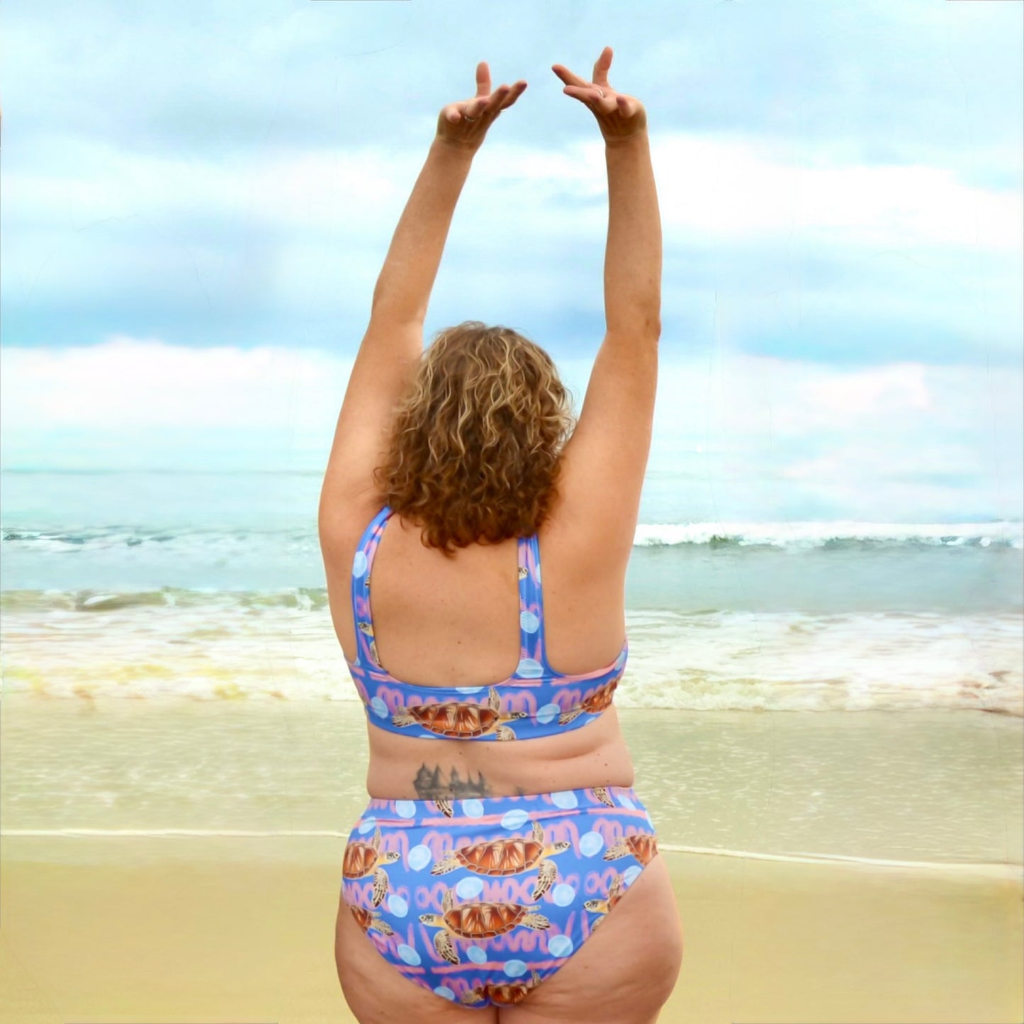 Royal blue and peachy background with sea turtles and moon jellyfish. Eco high waisted bikini bottoms 