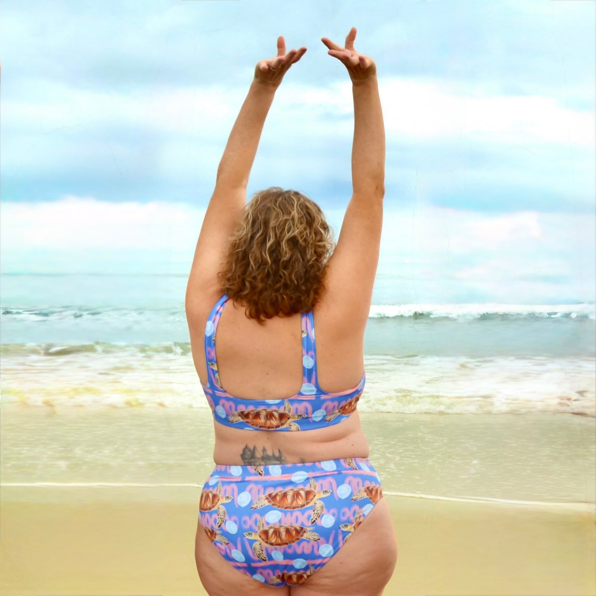 Royal blue and peachy background with sea turtles and moon jellyfish. Eco high waisted bikini bottoms 