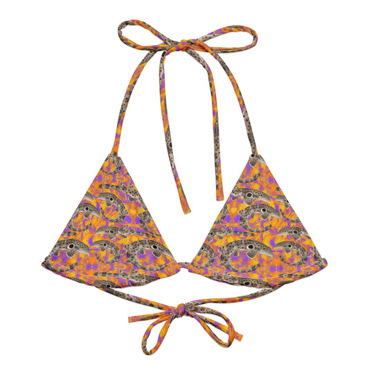 Epaulette Shark eco string bikini top with orange and purple background