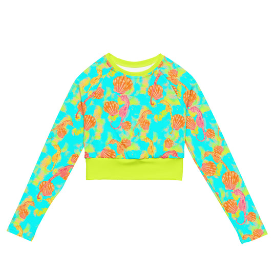 Pink and orange seahorses with sunrise seashells. Light aqua blue and yellow background with a neon yellow band. Cropped eco rashguard 