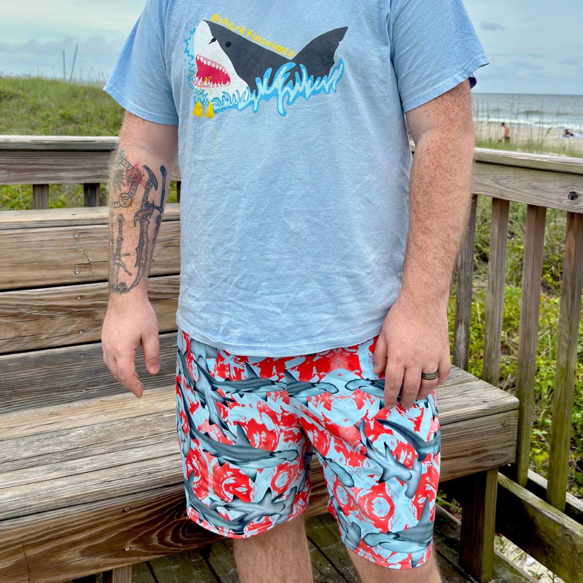 Fin & Fierce Hammerhead sustainable swim trunks blue and red background 