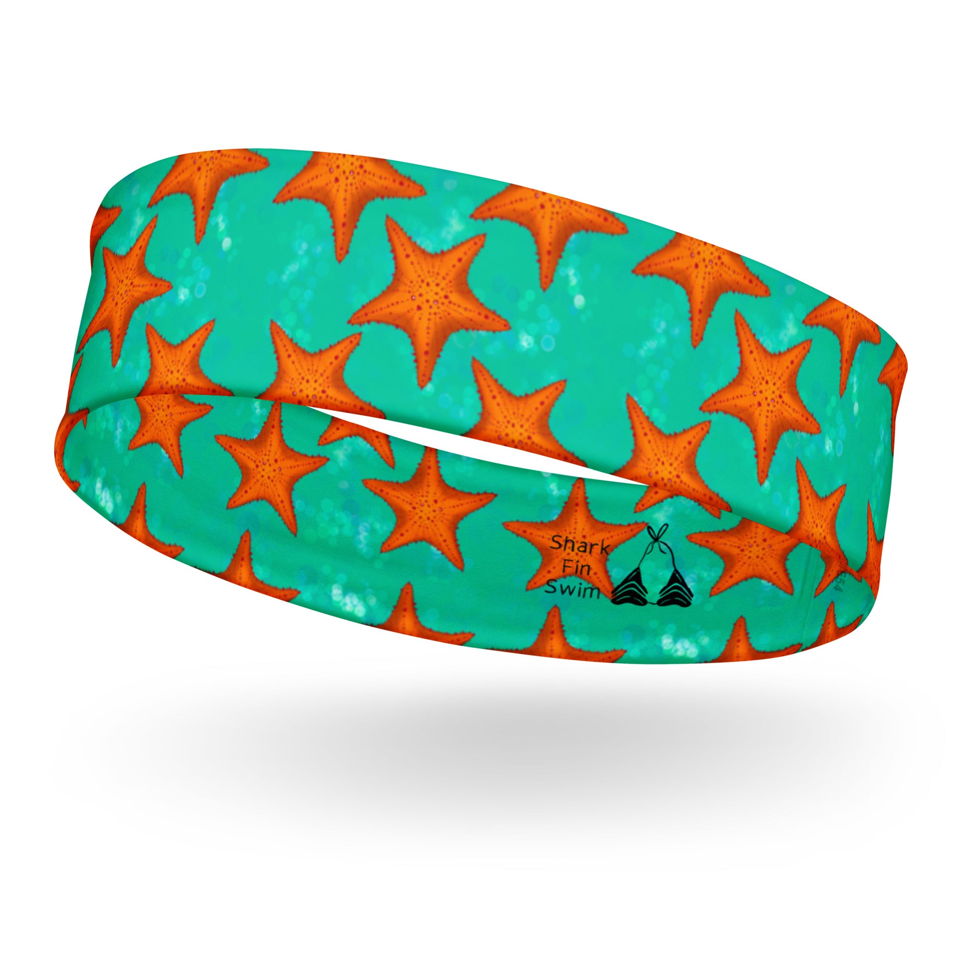 Headband with orange starfish pattern on a teal/green background