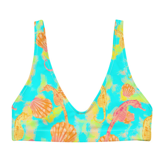Pink and orange seahorses with sunrise seashells. Light aqua blue and yellow background with a neon yellow band. Eco sporty bikini top