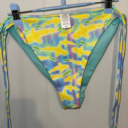 Yellow sharks on a blue colorful string bikini bottom on a hanger 