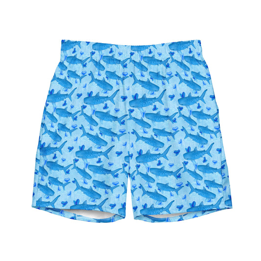 Baby blue waves and Sky Blue Tiger sharks swim around royal blue tiger shark teeth on our Tiger Beach Blues Recycled swim trunks 