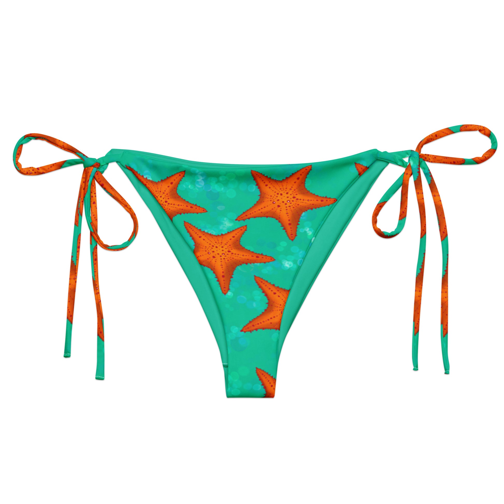 Green bikini bottom with orange star patterns on a white background