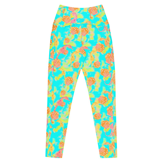 Pink and orange seahorses with sunrise seashells. Light aqua blue and yellow background with a neon yellow band. Eco dive leggings 