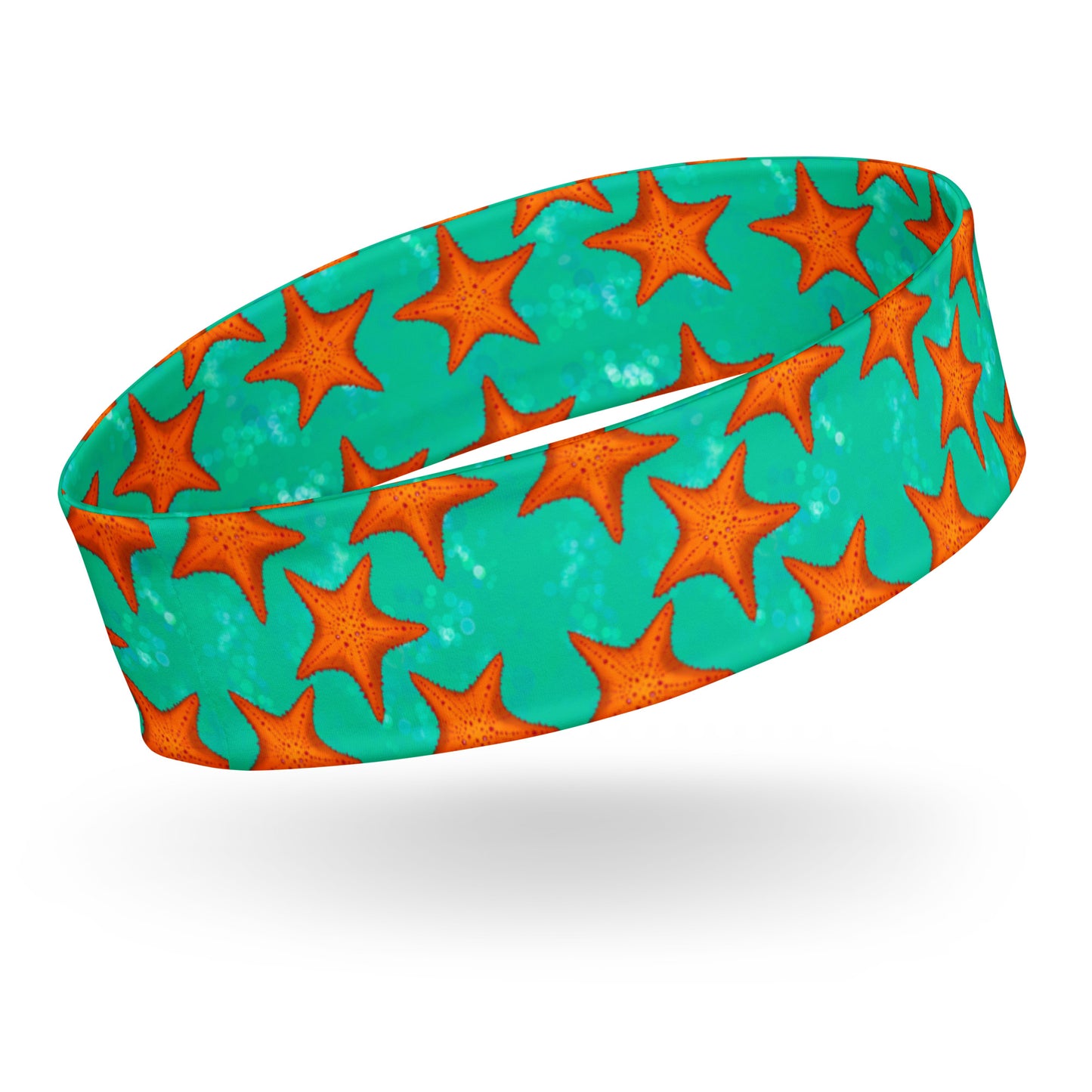 Headband with orange starfish pattern on a teal/green background