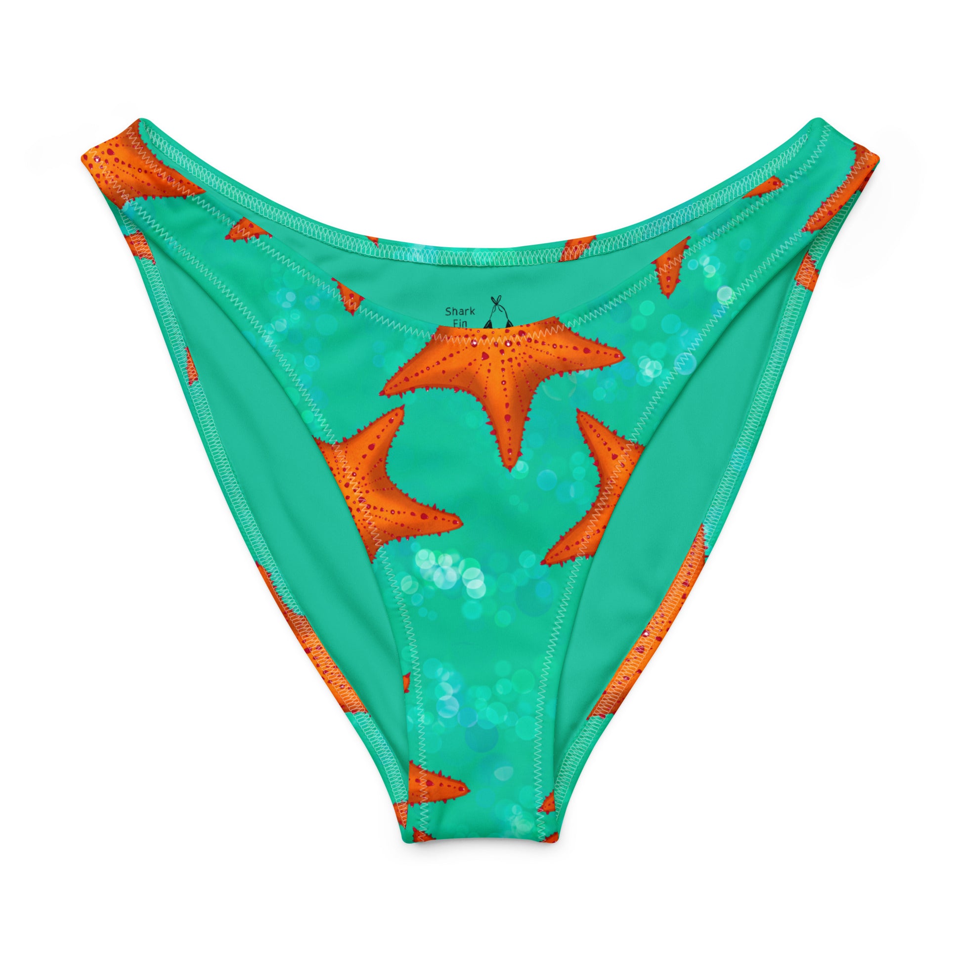 Green bikini bottom with orange starfish pattern on a white background