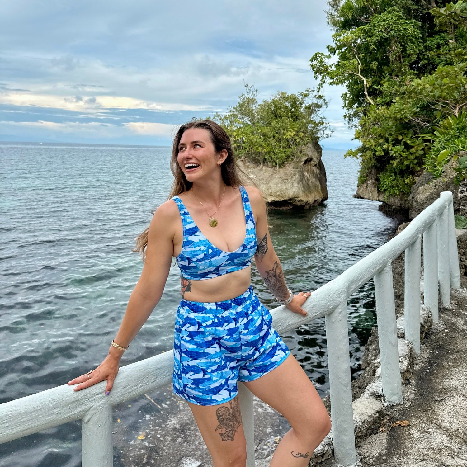 Blue water Brooke wearing our sour gummy whale shark sporty bikini top and shorts 